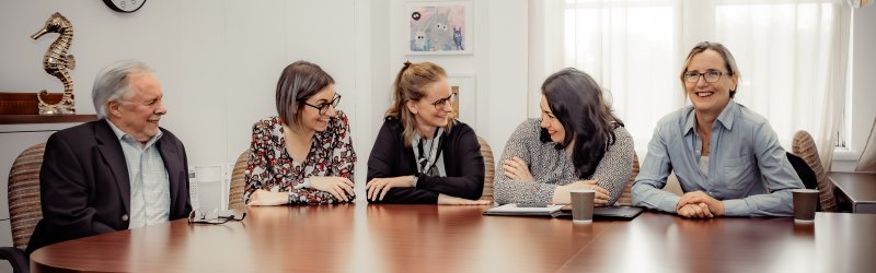 Team sitting at a table